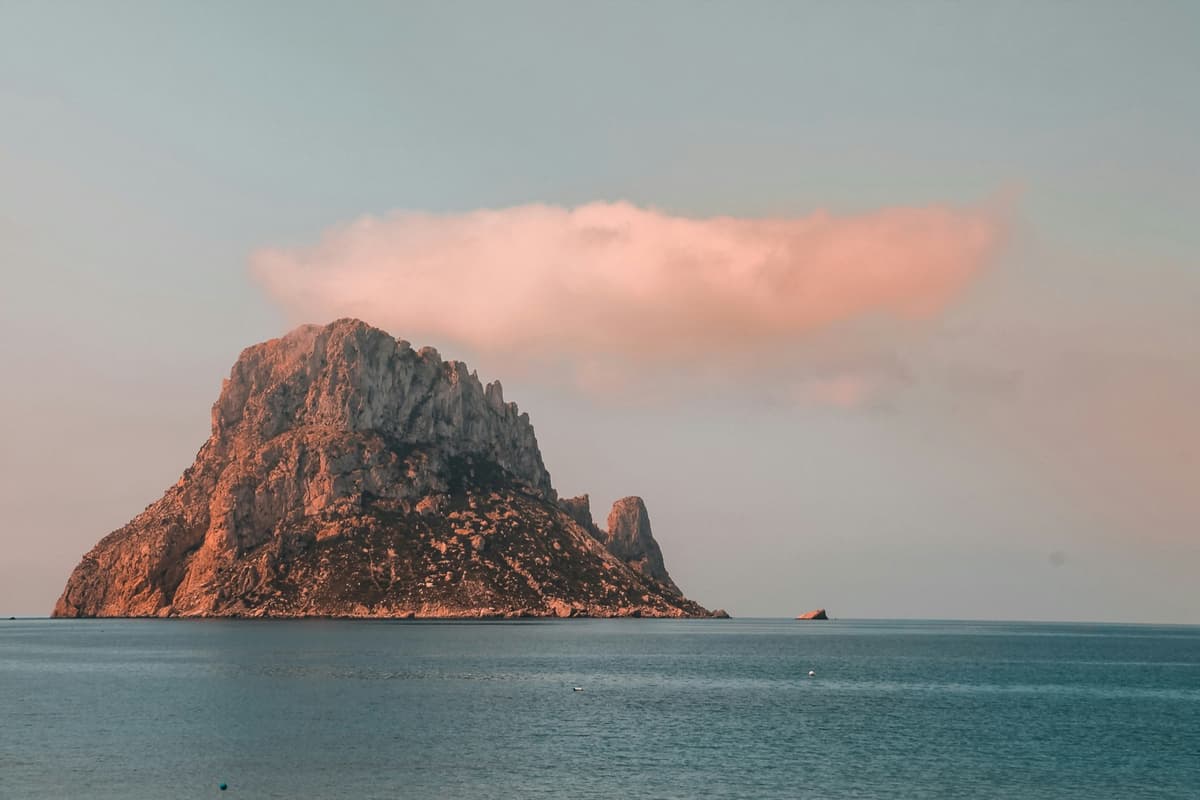 The islet of Es Vedrà off the southwest coast of Ibiza at sunset